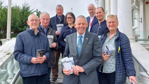Members of Cork County Council and Historic Monuments Advisory Committee displaying new information leaflets.