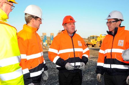 A group of men in safety vests