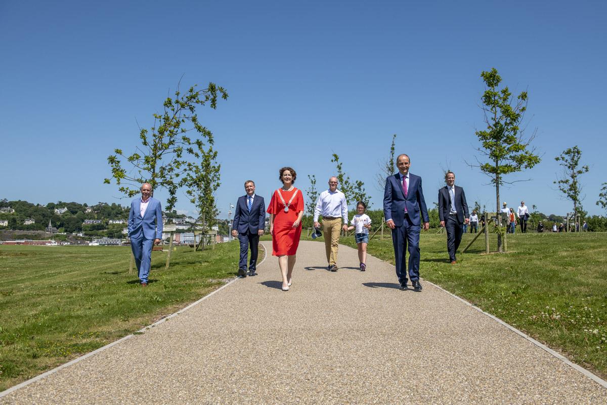 A group of people walking in a park