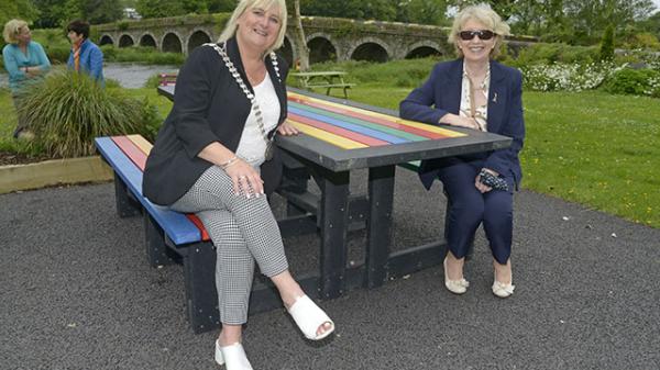 Mayor and Tidy Towns Chair on Bench beside river