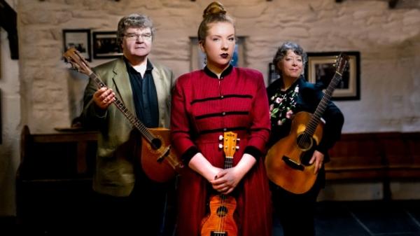 A group of people holding instruments