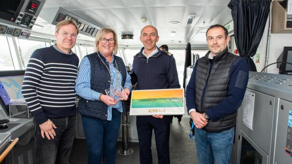 Cllr. Marie O’Sullivan, Chair of the Bandon Kinsale District and Cork County Council's senior harbour master Julian Renault exchanging gifts with the President of Ponant Cruises Hervé Gastinel and the ships captain Stanislas Devorsine on the bridge of the expedition cruise liner L’Austral which visited Kinsale last week. 