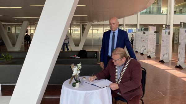  Mayor of the County of Cork, Cllr. Danny Collins, accompanied by Chief Executive of Cork County Council, Tim Lucey signing a Book of Condolence in memory Teddy McCarthy.
