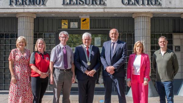 A group fo people stading in front of a leisure centre