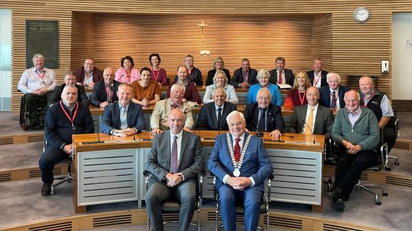 A group of councillors sitting in the council chambers