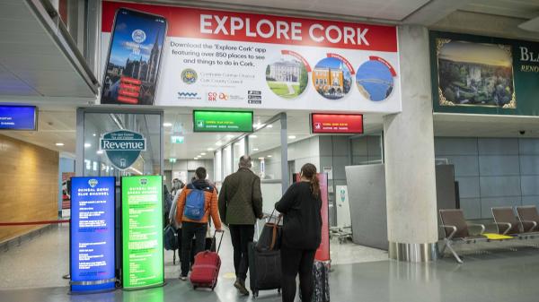 A Large Explore Cork sign visible in 'Arrivals' in Cork Airport.
