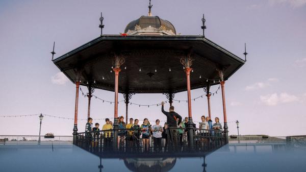 A group of people standing on a bandstand