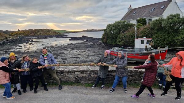 A group of people playing tug of war on Sherkin Island.