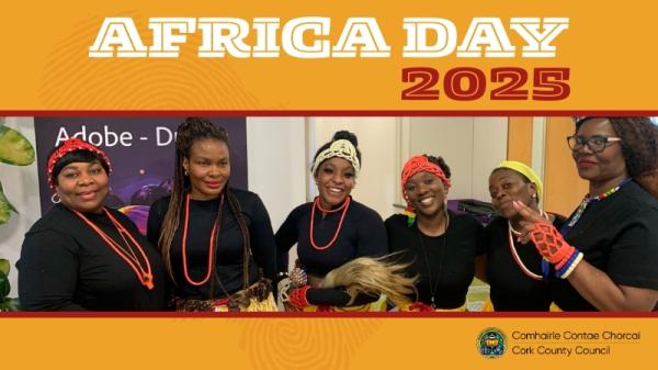 Group of people celebrating Africa Day 2025, wearing colorful outfits.