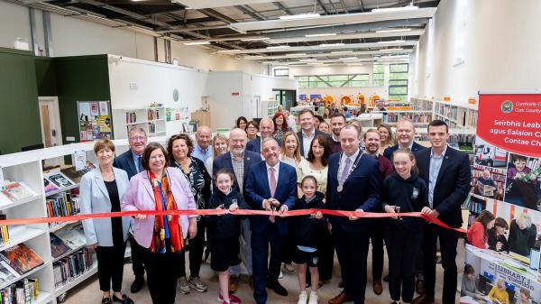Pictured at the official reopening of Carrigaline Library and the launch of My Open Library services in Carrigaline, Kinsale and Mallow are Chief Executive of Cork County Council, Moira Murrell; Minister of State with responsibility for Community Development and Charities and with responsibility for Rural Transport, Jerry Buttimer TD, and Cllr Patrick Donovan, deputising for the Mayor of the County of Cork, cutting the ribbon with Lila, Maddie and Lauren Fahy, pupils from Gaelscoil Carraig Uí Leighin.