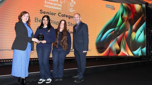 Students from South Cork have taken Best Display prize at this year’s Student Enterprise Programme National Finals. Pictured are St. Marys SEP Winners Muireann and Sinead pictured on stage with Enterprise Ireland, Teri Smith & Head of Enterprise, Carlow, Kieran Comerford.