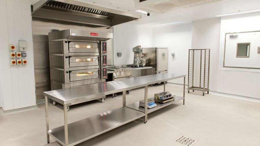 A room Containing Stainless Steel Industrial Kitchen Equipment