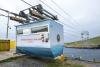 A cable car with an island in the background