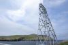 Cable Car Tower with blue sky, Sea and an Island in the background