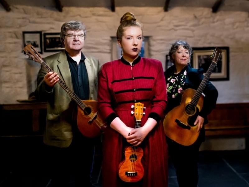 A group of people holding instruments