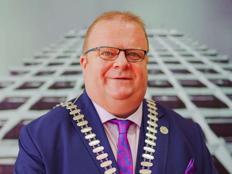 A portrait of a man in mayoral chains
