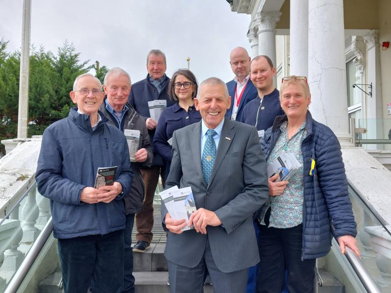 Members of Cork County Council and Historic Monuments Advisory Committee displaying new information leaflets.