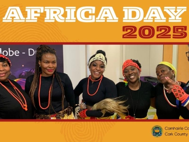 Group of people celebrating Africa Day 2025, wearing colorful outfits.