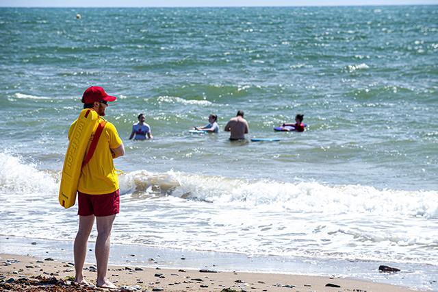 A picture containing outdoor, water, beach, shore