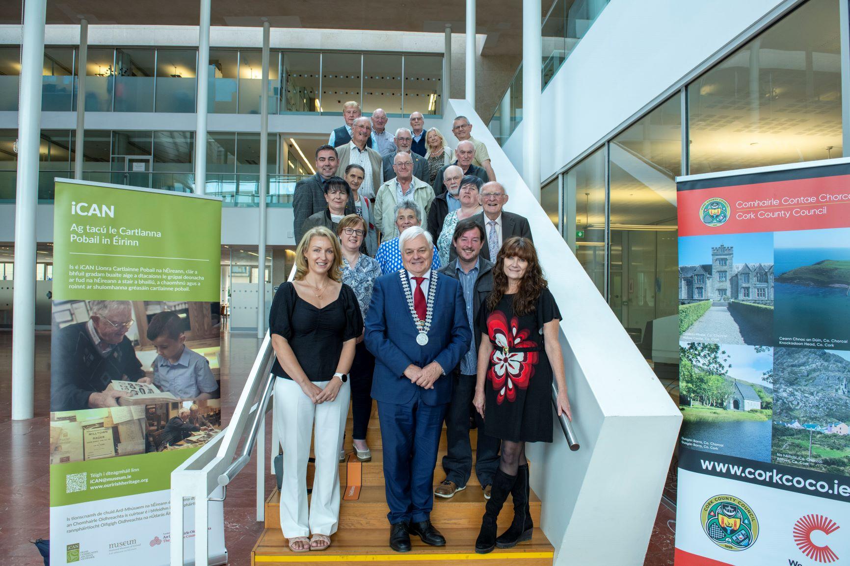 A group of people standing on a stairs