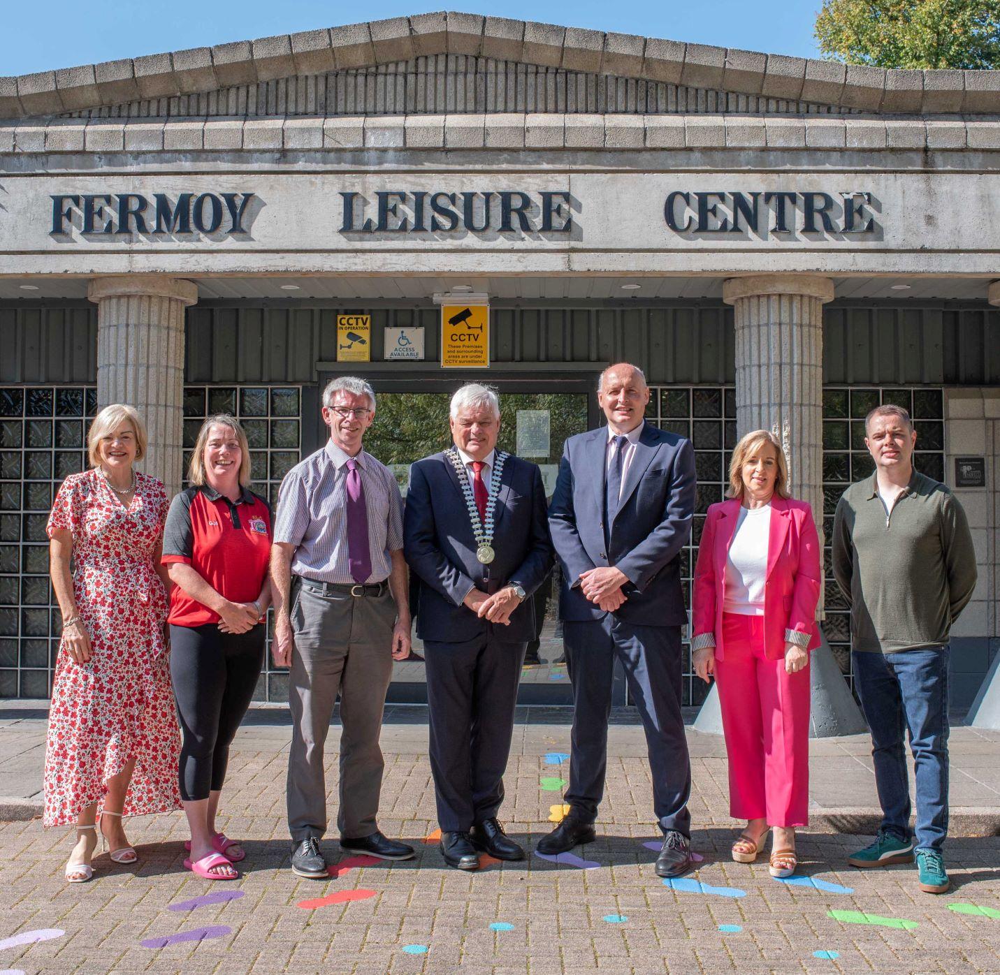 A group fo people stading in front of a leisure centre