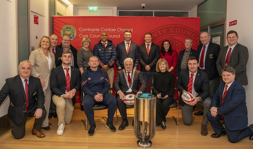 Mayor of the County of Cork, Cllr. Frank O'Flynn, Elected Members, Cork County Council Staff, Munster Rugby players, coaching staff and directors posing with the URC trophy at Cork County Hall.
