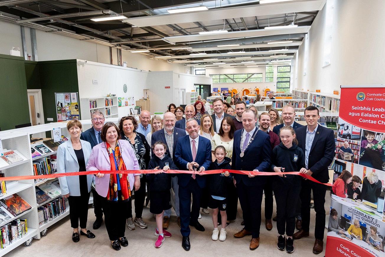 Pictured at the official reopening of Carrigaline Library and the launch of My Open Library services in Carrigaline, Kinsale and Mallow are Chief Executive of Cork County Council, Moira Murrell; Minister of State with responsibility for Community Development and Charities and with responsibility for Rural Transport, Jerry Buttimer TD, and Cllr Patrick Donovan, deputising for the Mayor of the County of Cork, cutting the ribbon with Lila, Maddie and Lauren Fahy, pupils from Gaelscoil Carraig Uí Leighin.